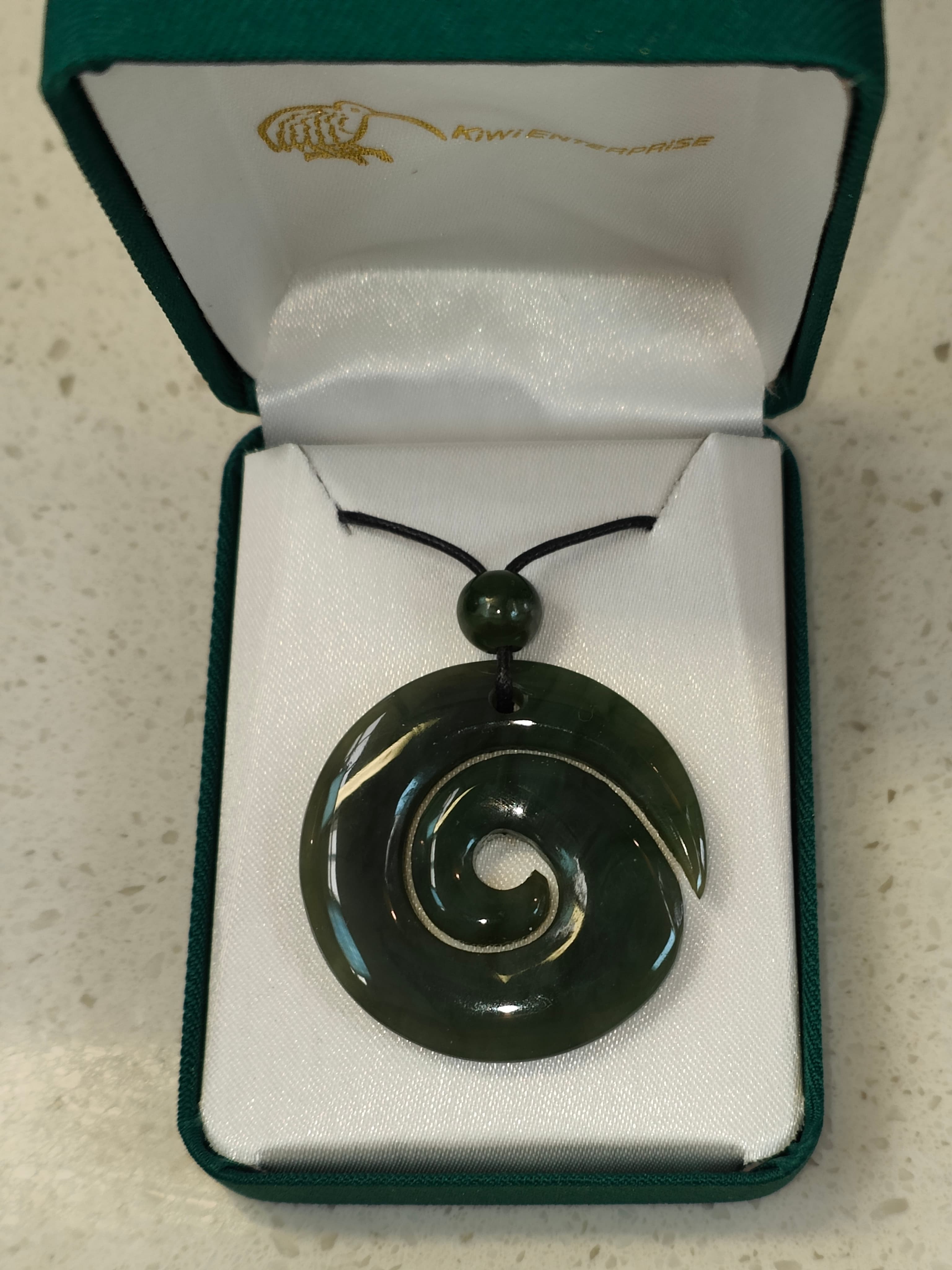 The koru (M?ori for 'loop or coil') is a spiral shape based on the appearance of a new unfurling silver fern frond. It is an integral symbol in M?ori art, carving and tattooing, where it symbolises new life, growth, strength and peace.