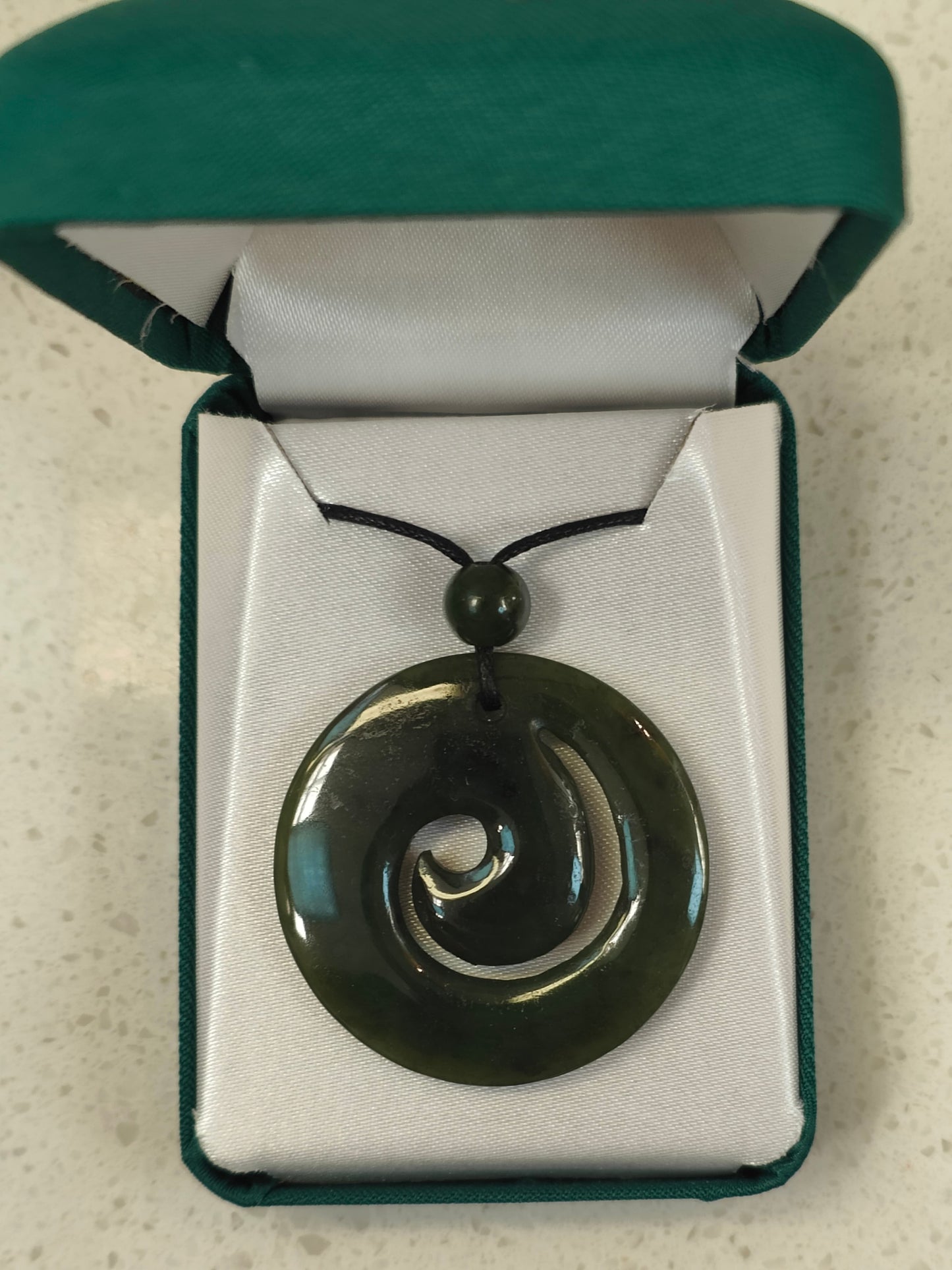 The koru (M?ori for 'loop or coil') is a spiral shape based on the appearance of a new unfurling silver fern frond. It is an integral symbol in M?ori art, carving and tattooing, where it symbolises new life, growth, strength and peace.